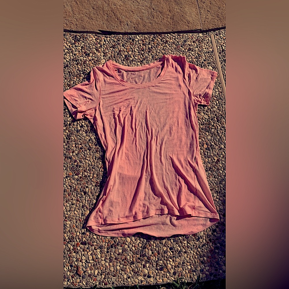 Lululemon athletic shirt. The color is pink and white. The size is a S-M.